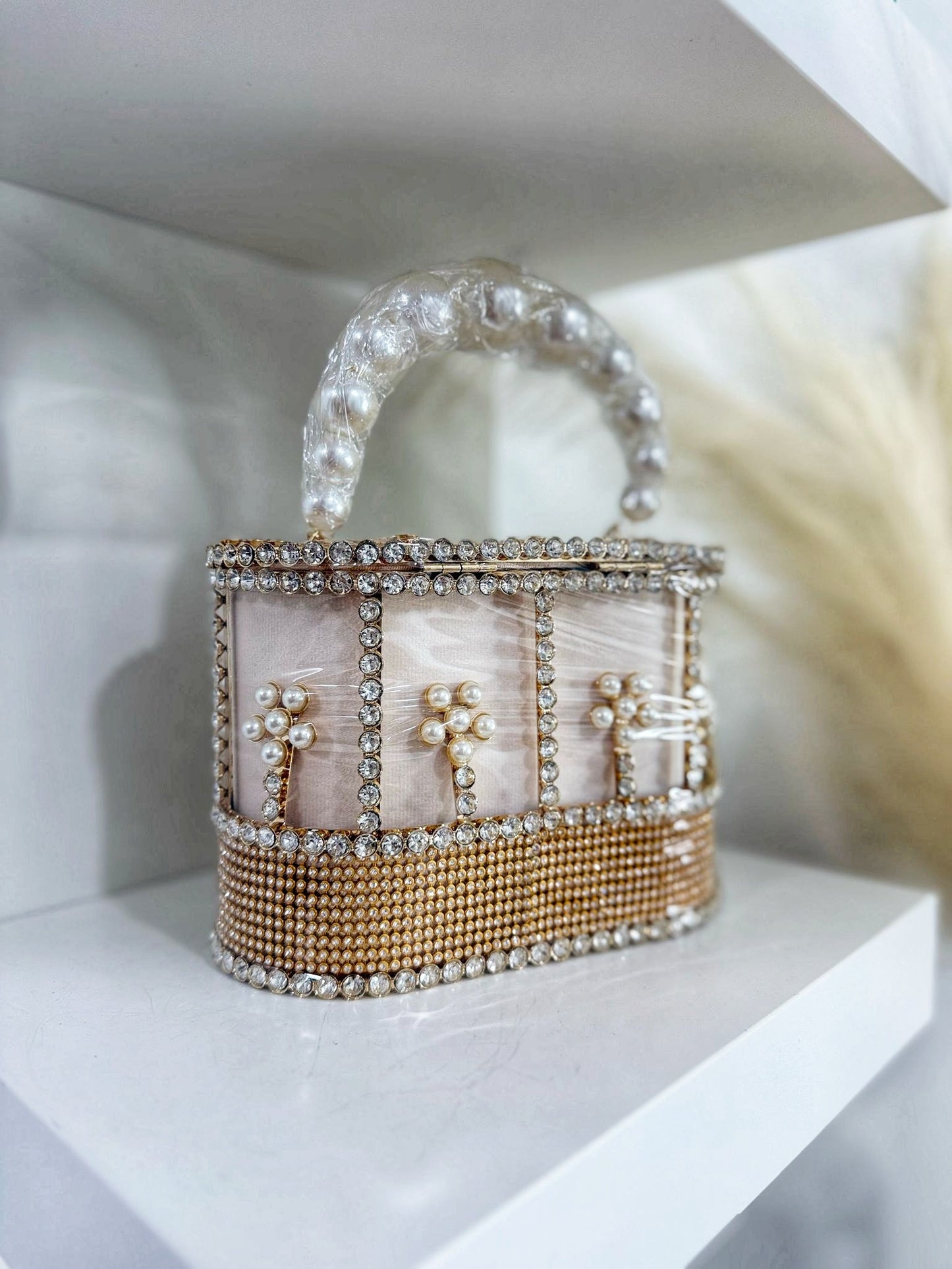 Exquisite pink purse adorned with delicate pearls and shimmering beads
