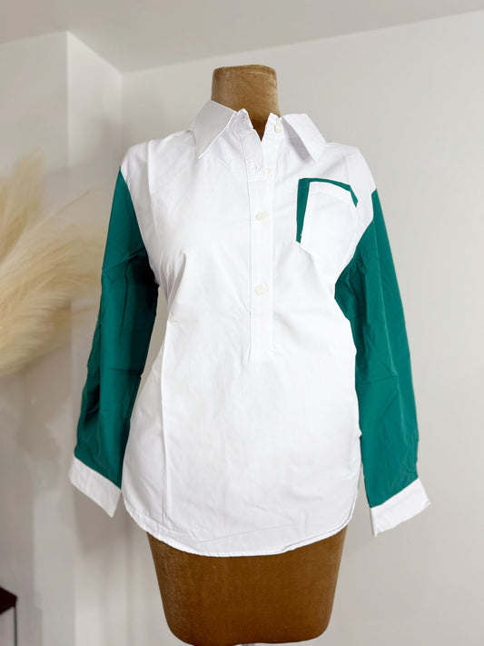 White shirt featuring vibrant green sleeves and a matching green collar.